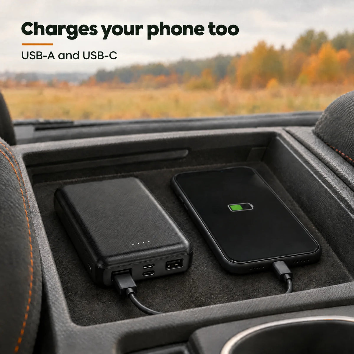 The power bank charging a smartphone in the car